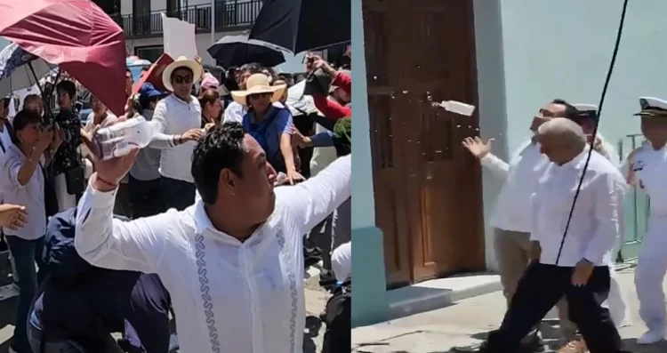 Elude  AMLO golpe de botella con agua lanzada por trabajadores del Poder Judicial en Veracruz